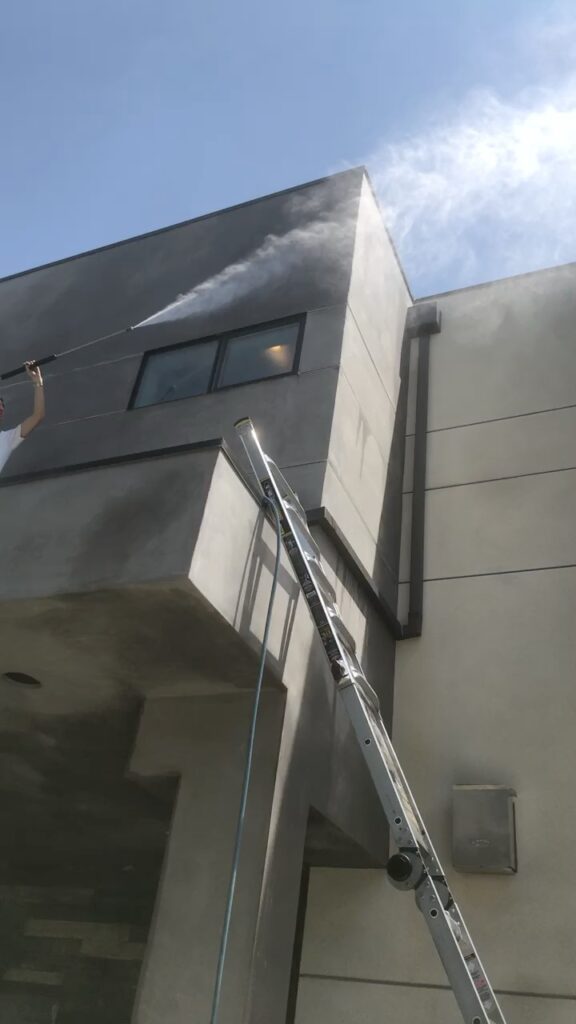 Our staff does commercial pressure washing services for the windows and walls of this high-rise house in Beverly Hills.